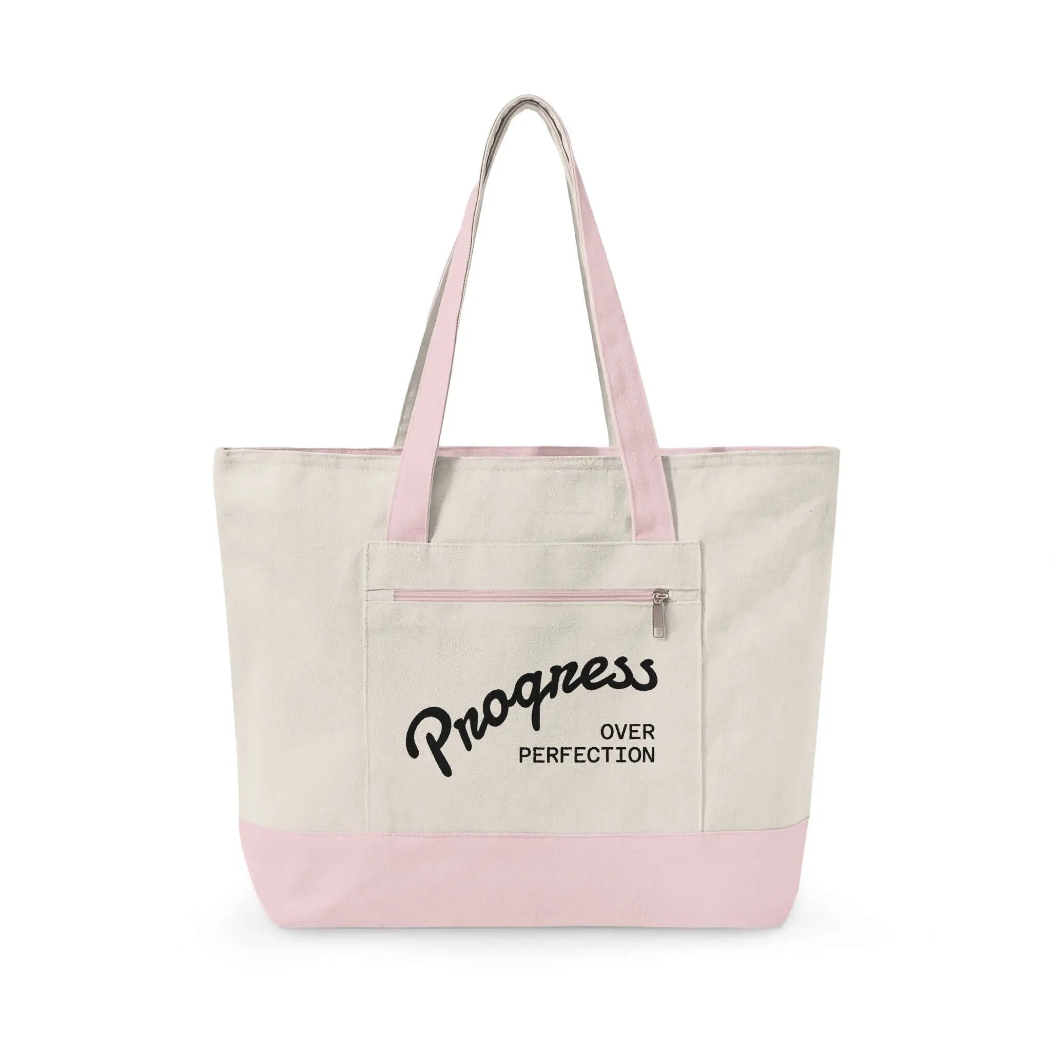 Progress Over Perfection Tote Bag | Minimalist canvas tote bag with black straps and zipper pocket featuring the motivational quote “Progress Over Perfection” in bold black typography on a neutral cream background.