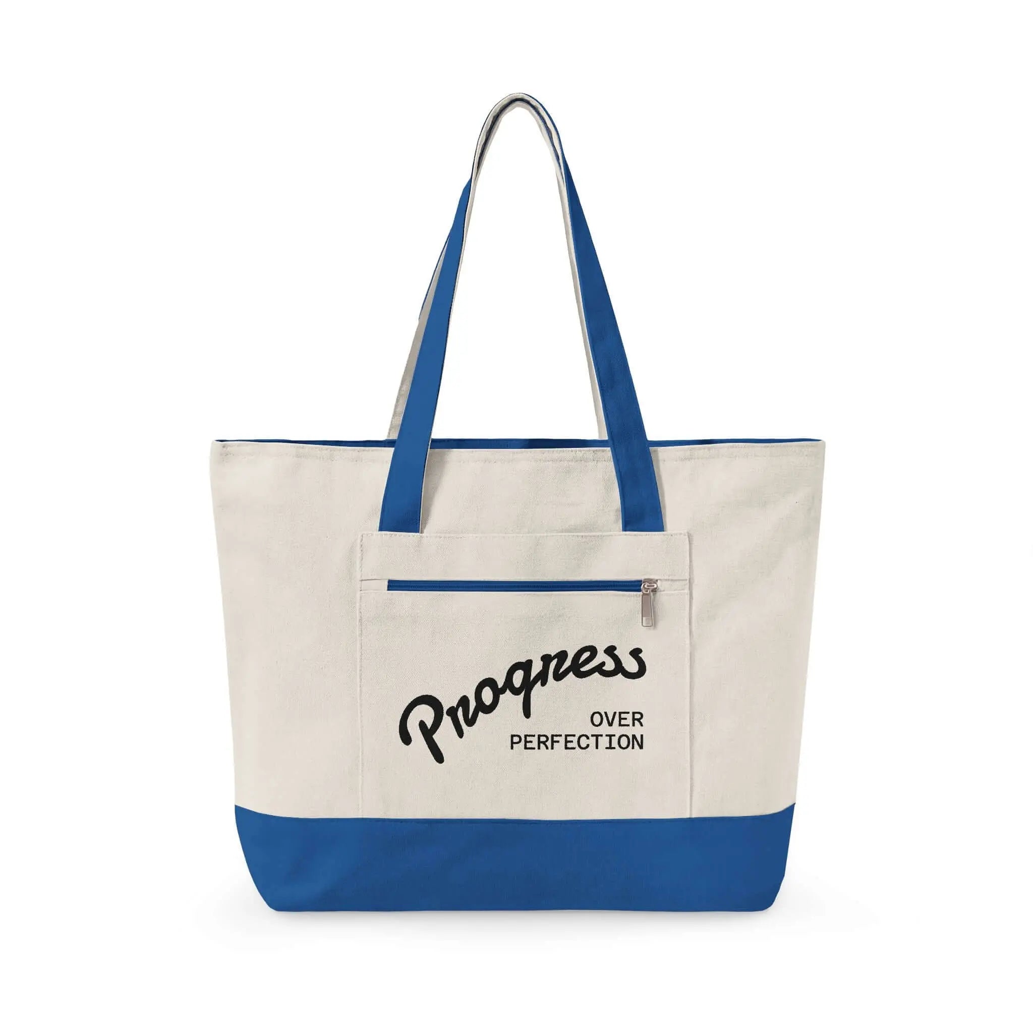 Progress Over Perfection Tote Bag | Minimalist canvas tote bag with black straps and zipper pocket featuring the motivational quote “Progress Over Perfection” in bold black typography on a neutral cream background.